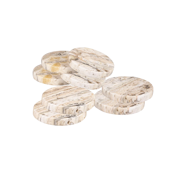 Product and lifestyle images of GAURI KOHLI Tasmania Coasters with wine glasses for scale